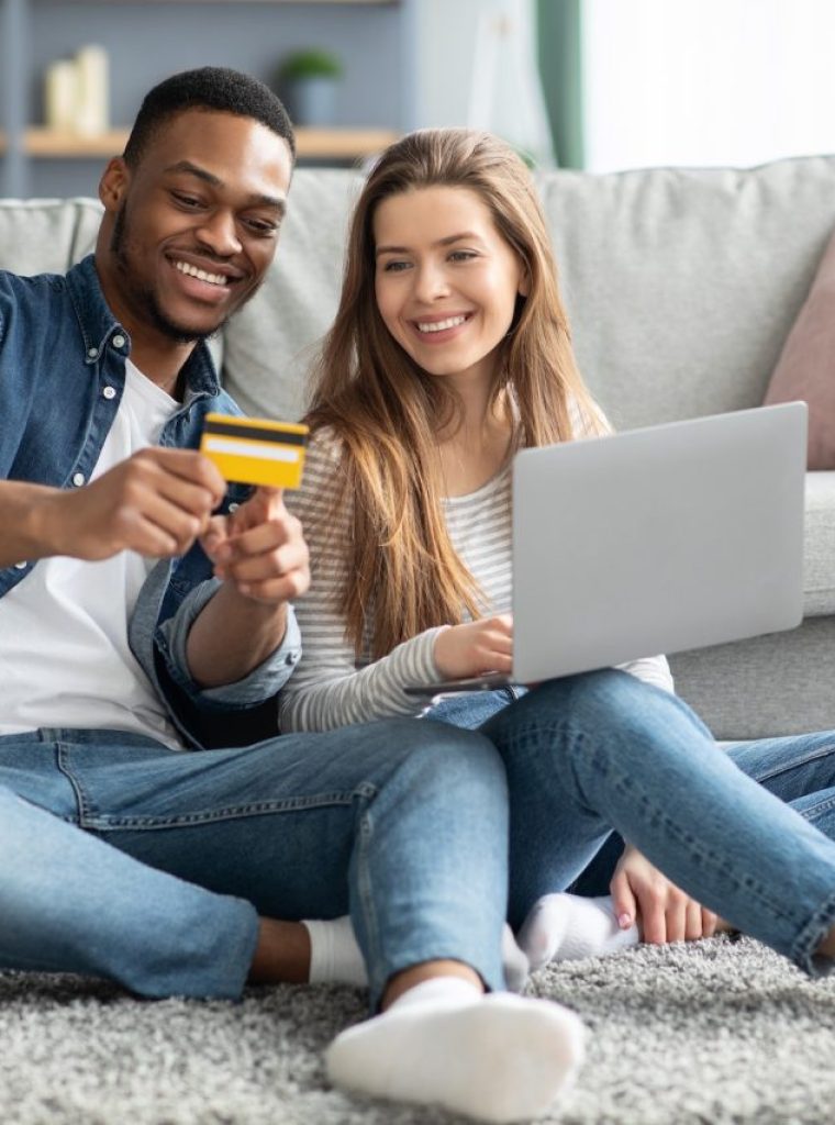 online-payments-young-interracial-couple-with-laptop-and-credit-card-at-home.jpg